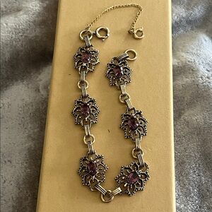 Beautiful Bracelet with light purple glass stones with safety chain